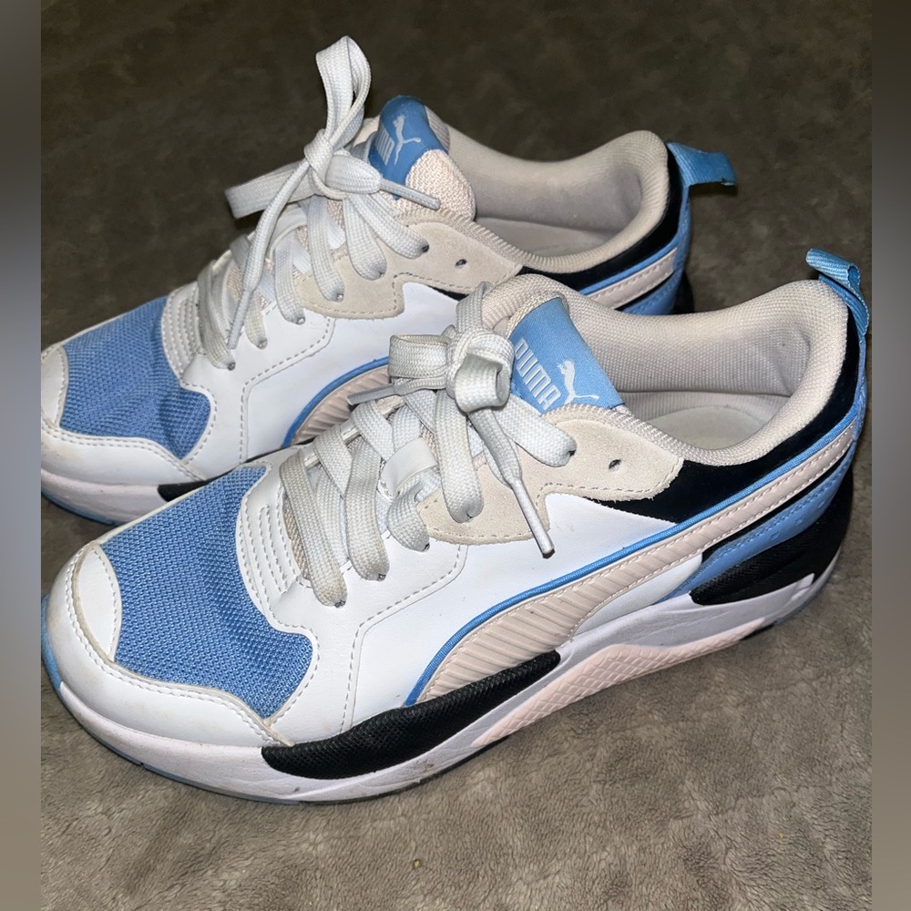 Women’s PUMA X Ray Game shoes. They are blue,pastel pink, black & white color.